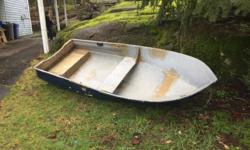 10' Fiberglas boat with electric motor, battery, and charger. Everything you need to get out on the lakes