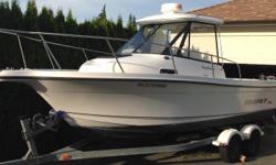 2003 Trophy Pro Hardtop 2052 model. 4.3 litre mercruiser with freshwater cooling and alpha 1 drive. Includes tandem Karavan trailer with updated disk brakes, lowrance elite 7 sounder with charts, radar, wash down, bait well, vhf with distress attached to