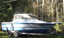 1988, 21 ft. Bayliner, Tropphy class with cabin, comes with head, radios, fishfinder and chart plotter, gal. trailer. 4cy, 3 l. inboard with 20 hp merc kicker.
