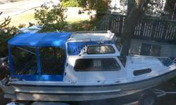 Welded Aluminum Boat with a lock-up cabin and stand-up canvas cover. Custom Road Runner Trailer with tandem wheels. Yamaha Outboards - 150 and 9.9 hp. Many extras. Would consider trade for a smaller boat.