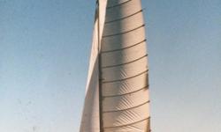 Malcolm Tennant design cedar strip and epoxy catamaran for sale
38 ft. rotating aluminum mast with swept diamond spreaders,
4 sails in good shape, 2 jibs drifter,square top Main.
2 single berths in each hull.
twin daggerboards, pivoting rudders.
total