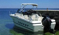 Bayliner Trophy Sportfisher 93with Cuddy cabin/ walkaround hull ready to fish. Plugs for down riggers /GPS sounder. good running 175 merc outboard,serviced locally. ready to fish w Beautiful 2005 Galvanized quad trailer.(purchsed trailer 2006 for 4000.