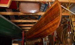 Western red cedarstrip canoe, very good condition, traditional rawhide seats, white ash trim, hardwood portage yoke, brass hardware, top of the line canoe, always garaged when not in use. $450.  Will not be available until later this spring.