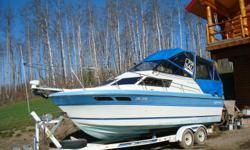Campion Hiada Suncruiser.  26 foot.  350 OMC.  Sleeps 5.  Kitchen, bathroom and a holding tank.  4 batteries.  Tandem galvanized trailer with brand new tires.  Marine and ordinary radio.  25 watt inverter.  Rigged for electric downriggers.
