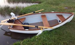 9 foot Victoria manufactured Whitehall rowing tender boat comes with custom fitted Road Runner trailer, excellent tires w/spare, custom made waterproof Sunbrella cover, finished in teak with a set of oars and comes with a 55 lb thrust electric salt water