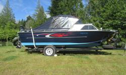 This beautiful and super clean 1989 Sylvan Aluminum Offshore has always been stored indoors. It has a 135 HP Mercruiser motor and a Honda 8 HP Kicker motor. It has GPS and 2 downriggers. The trailer is a Load Rite that is also immaculate with new