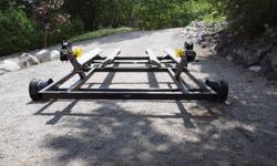 Custom made cart for dual 3 person PWC's.  Was going to use it on a marine railway but we are moving and I do not have a railway on our new property.  Never used.  Steel construction.  Cedar wrapped full length bunks.  Poly non-marking bow stops and