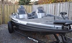 2002 Nitro NX 882 bass boat in excellent condition. Dual console. 18' 2" 115 HP Mercury 2-stroke outboard with stainless steel prop. Black with silver fleck. New trailer tires, new LED lights, trailer brakes, 5" colour GPS with 2 navionics chips and