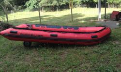 14' inflatable heavy duty boat complete with heavy duty rowing frame, Carlisle oars and brass oar locks, wheels for easier moving on land. Boat has been used once for a hunting trip then dry stored, in new condition. New price without rowing frame, wheels