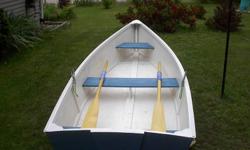 11 Foot wooden rowboat. New,never used. Complete with new oars and oarlocks.$600 OBO.