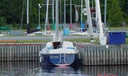 Boat in good shape. Needs some TLC. 23' masthead sailing sloop, fiberglass construction complete with 5HP Mercury outboard (less than 3 running hours - $1900 new)) and dry-dock cradle. Well maintained and many updates. 3 sails including main, genoa, and