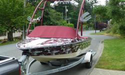 This is a 18.5' 1995 sea Ray, ski Ray true inboard direct drive tournament boat. Powered by a powerful Chevy 350 with a velvet drive. This boat can pull a very heavy rider out of the water on a deep water start in seconds. The boat has a full custom wrap