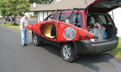 Kayak lift-assist carrier. Gas struts supports kayaks up to 36" wide & 75 lbs., load while rack is at the side of a vehicle. Lockable. $540.00