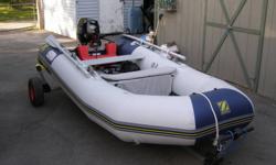 boat in a bag, inflatable, hard floor 2010 Zodiac Cadet 310 10'2" long 5'4" wide 4 passengers 2 zodiac quick fit benches 1 boatmate underseat bag Hand launch trailer Next to NEW only used 2X (motor not included)