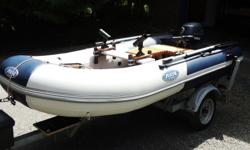 10.5 ft. Zodiac Zoom with NEW Yamaha 9.9 - 4 stroke outboard, EZ load trailer, tie downs, guide-ons, hitch, spare wheel, boat cover, custom seats, rod holders, tool box, carrying bag, pump, all documents. Boat in the water 3 times, motor used twice - this